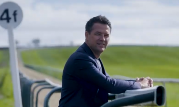 Michael Owen looking over the gallops where his horses train and receive premier league care.