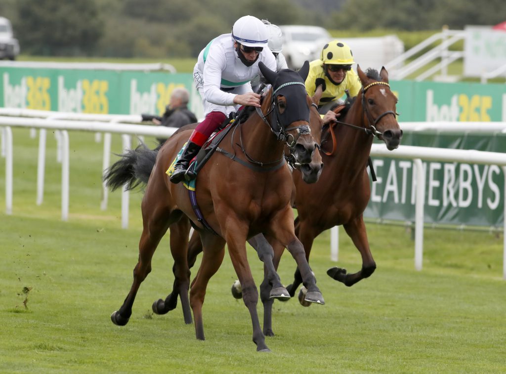 Indigo Girl and Frankie Dettori winning The bet365 May Hill Stakes  Doncaster